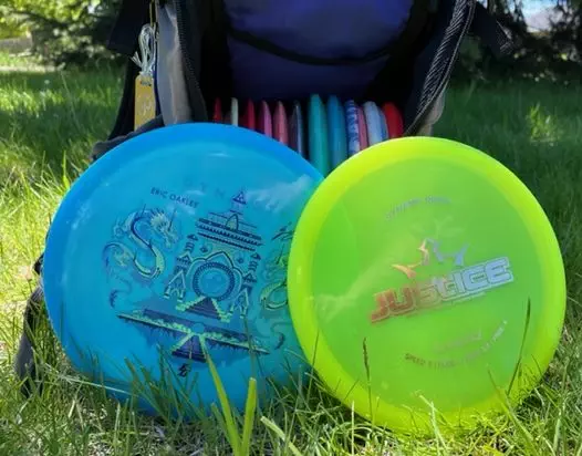 IMG 3665 e1654209468553 Disc Golf is a lot like golf . . . except for the fact that the gear used is not standardized. Meaning, in Golf, everyone's club head angles are pretty much the same. A Callaway 9 iron will be highly similar to a Taylormade 9 Iron. Whereas in disc golf, a Discraft 9 speed fairway driver may or may not be similar to a Innova 9 speed fairway driver. And if they are similar, they can still fly very different from one another. Because of this, choosing and finding the right kind of disc can be quite overwhelming, and may be discouraging. The point of this article is to help better the understanding of disc golf disc classification, and their intended purpose. Here, we will discuss fairway driver vs midrange specifically.