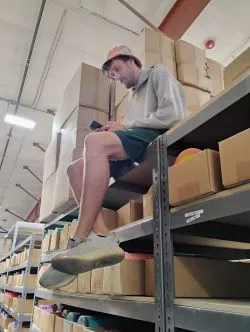 Alex working hard from high on the disc golf shelf tops.