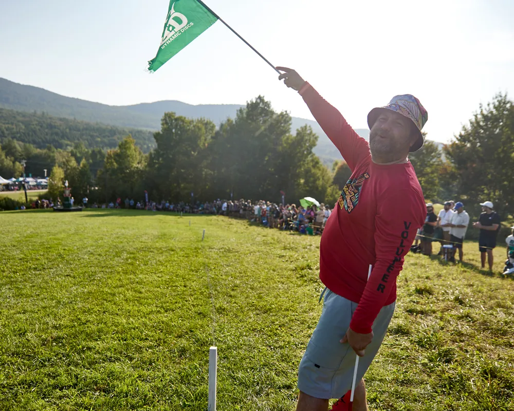 A spotter at a disc golf tournament