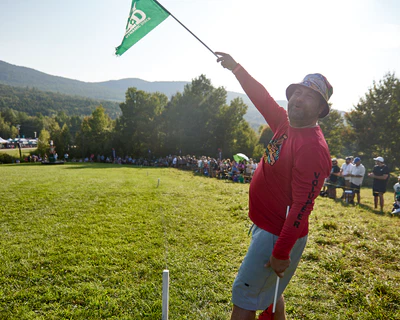 A spotter at a disc golf tournament